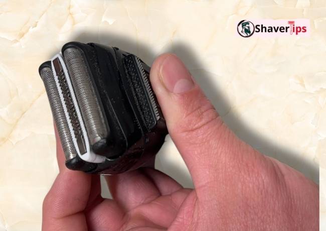 Angled front view of Braun Series3 32B Replacement Head in hand