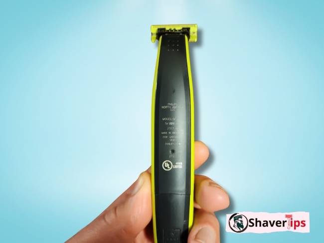 Philips Norelco shaver held with fingers